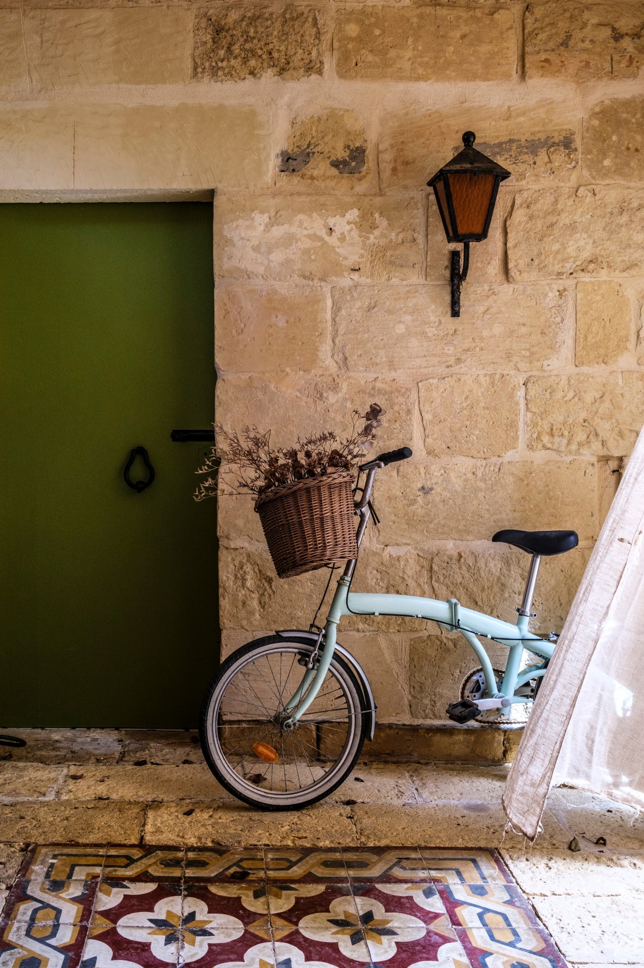 Green door and folding bicycle at The Bored Peach Club