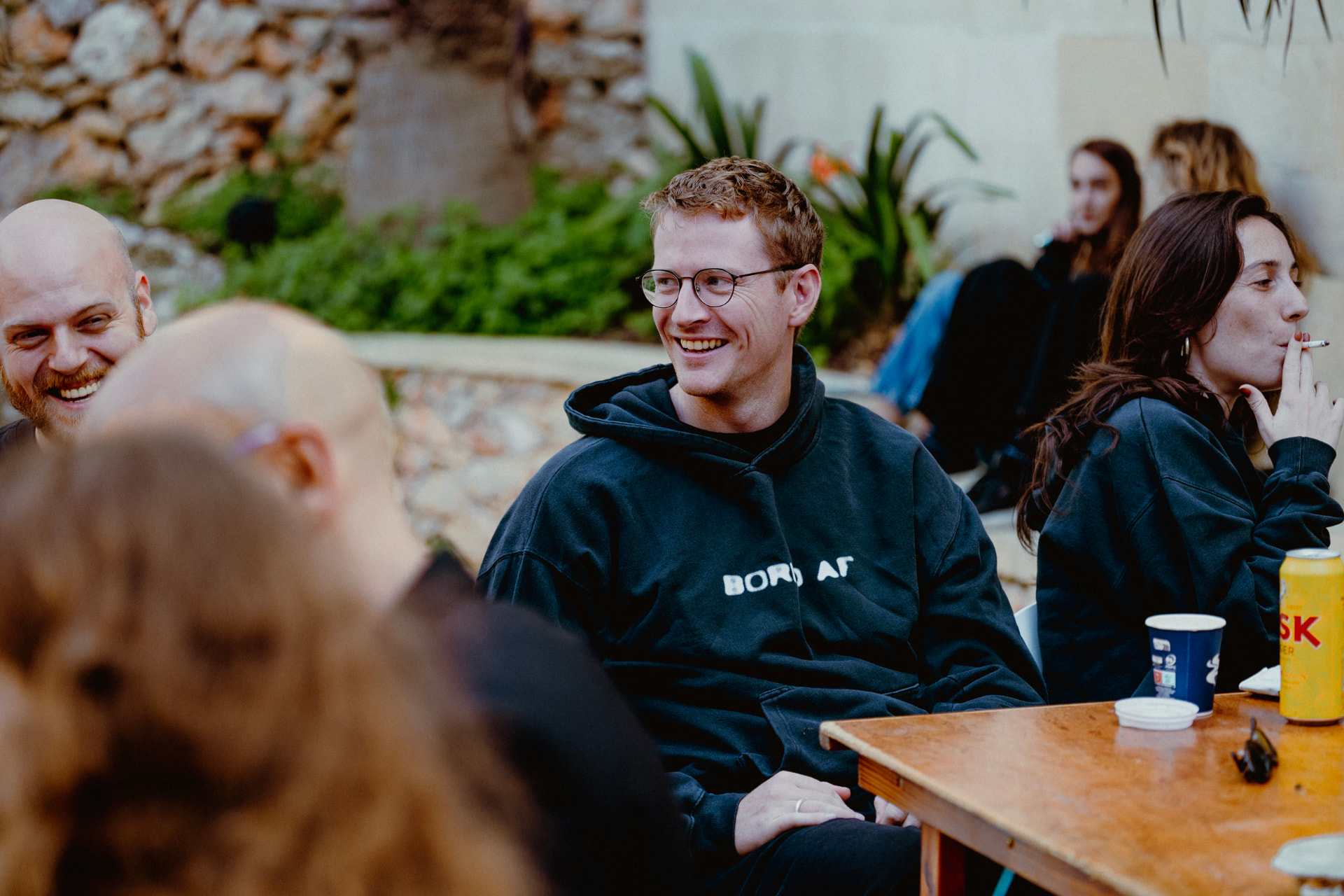 Group talking in the garden after a session